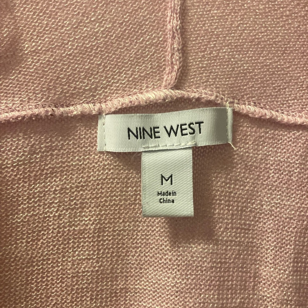 Lightweight pink cardigan.